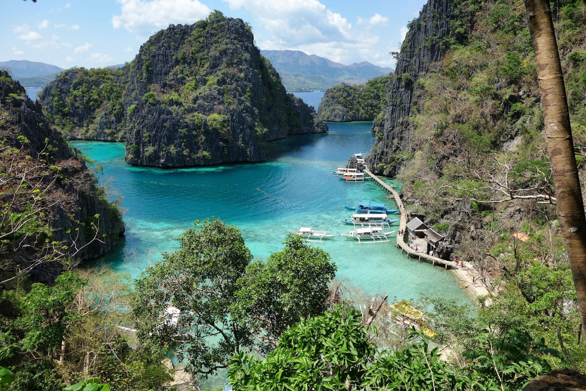 a group of boats that are sitting in the water